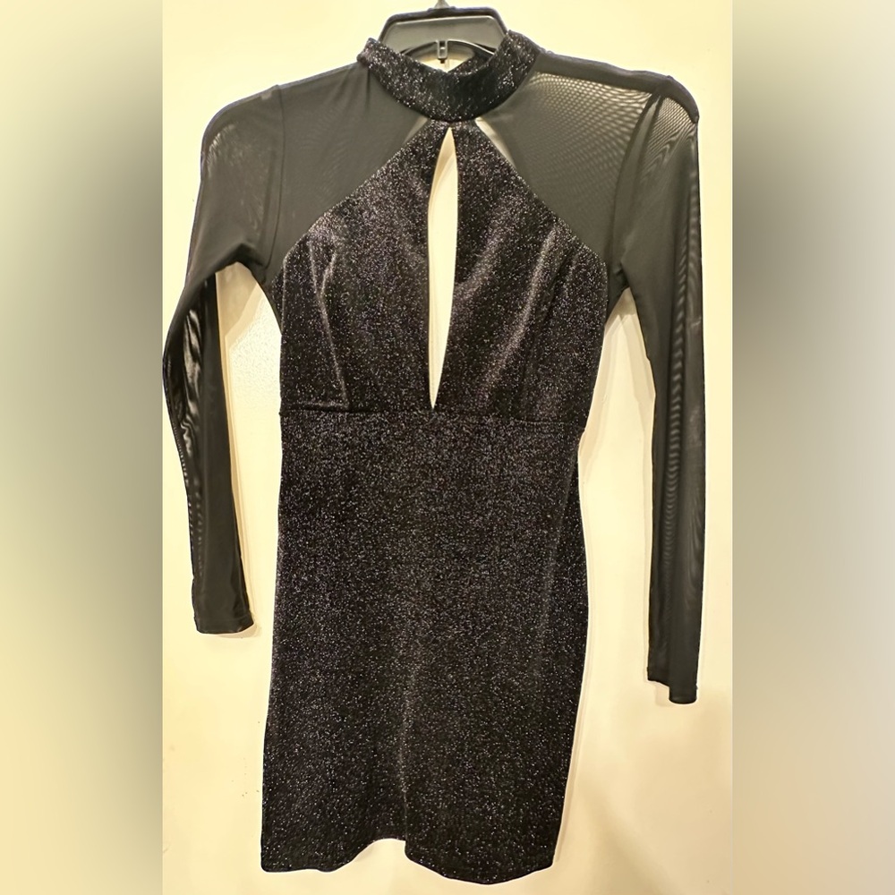 New size small.  Black Back out  Shimmer Mesh Dress knee length